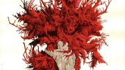 A stylized illustration of red coral branching from a gray base, resembling a fantastical entity.