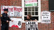Student protestor and Harvard police officer during the Mass Hall living-wage protest, April 25, 2001