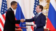 President Obama and Medvedev of Russia shake hands after signing the New START treaty in 2010