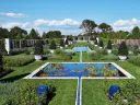 Wide view of blue pools and lawns of the Blue Garden