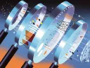 Four stylized magnifying glasses arranged in a gradient background with abstract patterns.