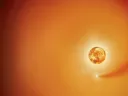 A glowing orange sun with a star and a trailing gas cloud in space.