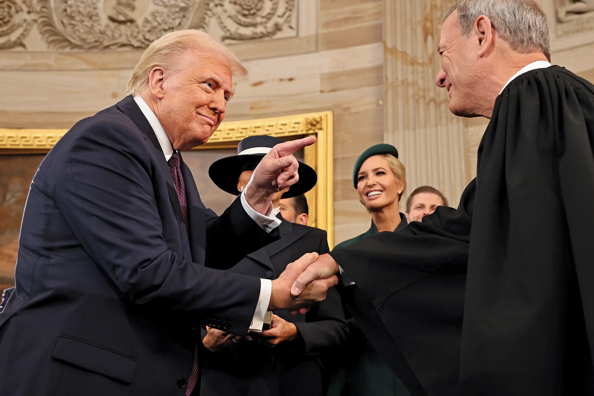 President Trump shakes hands with Justice Roberts in the Capitol rotunda