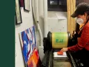 Photograph of Sarah Kariko ’90 operating a letterpress at the Bow & Arrow Press in Cambridge, Massachusetts