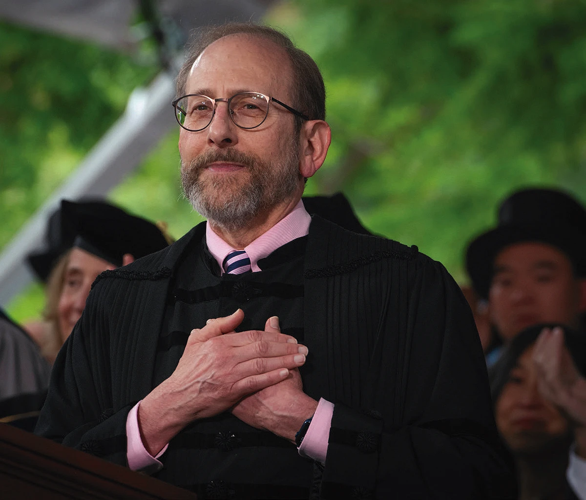 Harvard President Alan M. Garber holds his hands to his heart