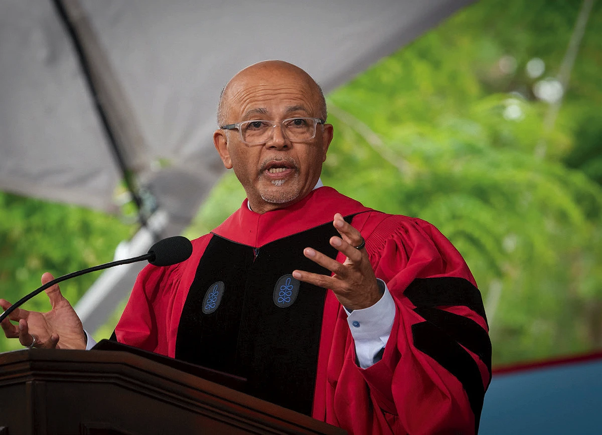Abraham Verghese speaks at a podium