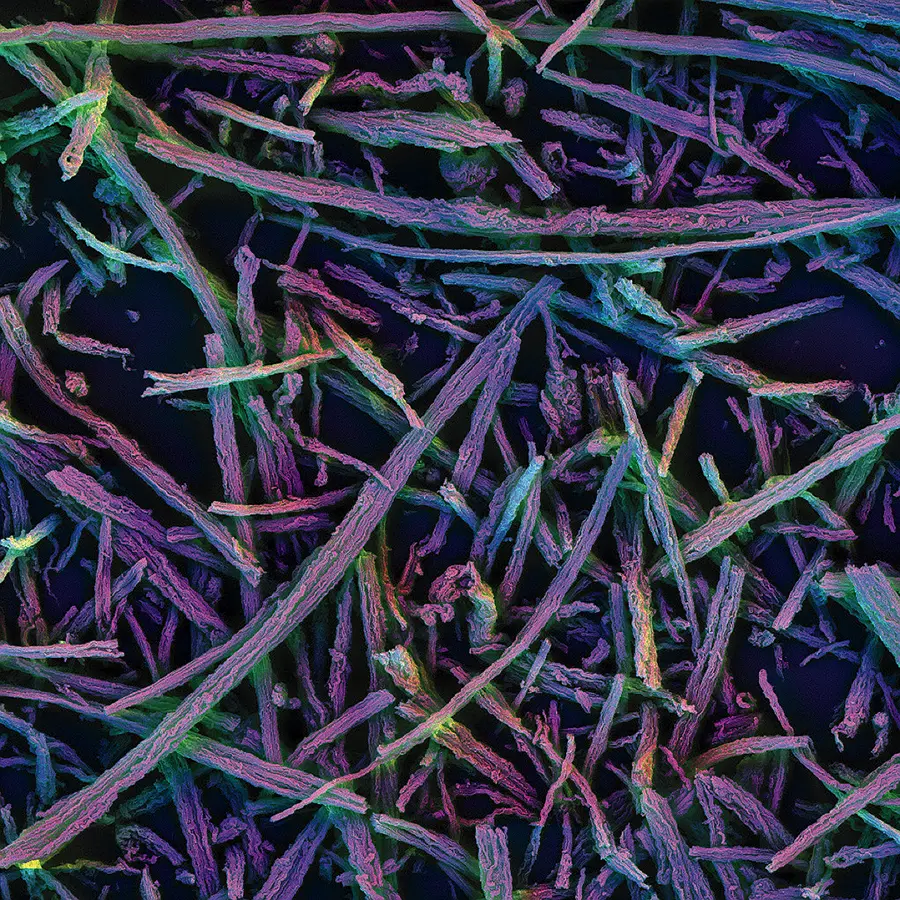 Colorful nanoscale silica rods under a microscope, showing their porous structure.