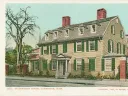 Wadsworth House with green shutters and red brick chimneys, surrounded by trees and other buildings.